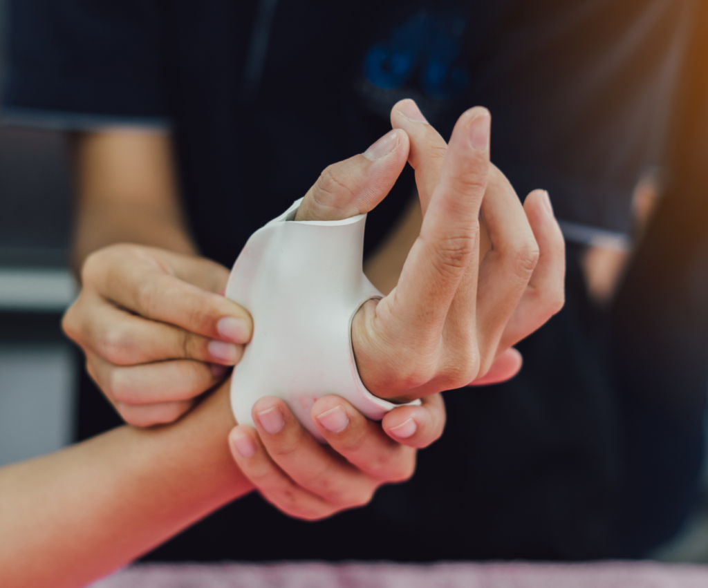 Surgeon performing hand surgery to restore function after trauma, ensuring precision and care in a sterile operating room.